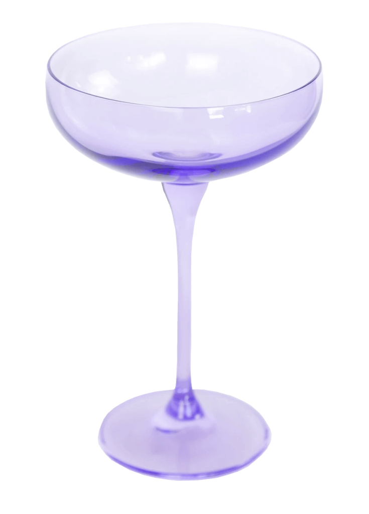 A lavender colored champagne coupe. 
