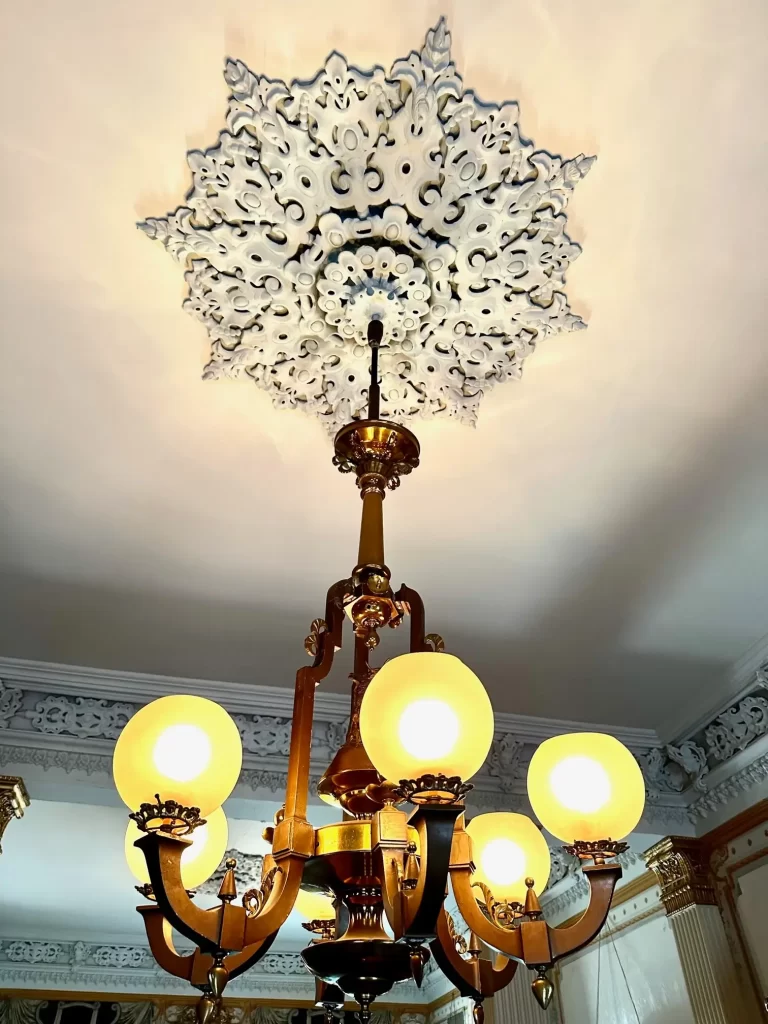 The 19th-century gasolier in the front parlor of the Gallier House in New Orleans.