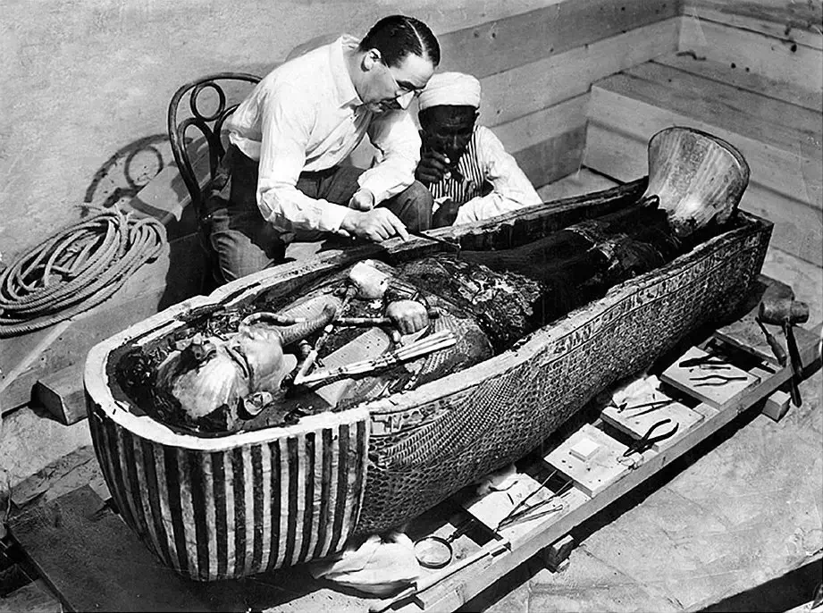 Howard Carter opening King Tut's sarcophagus. 