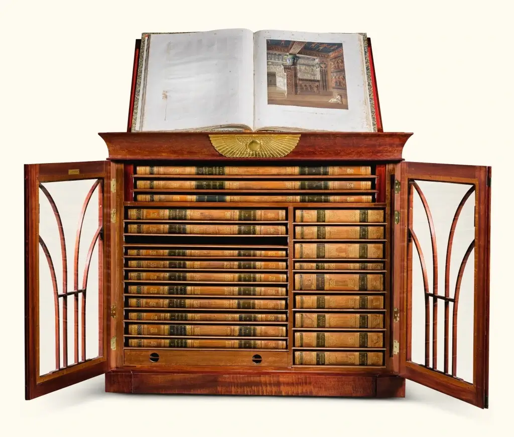 The full collection of "Description de L'Egypte" housed in a decorative book case.