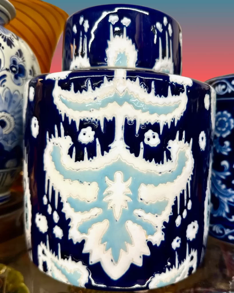 A ceramic ginger jar with lid featuring a stamped ikat pattern.
