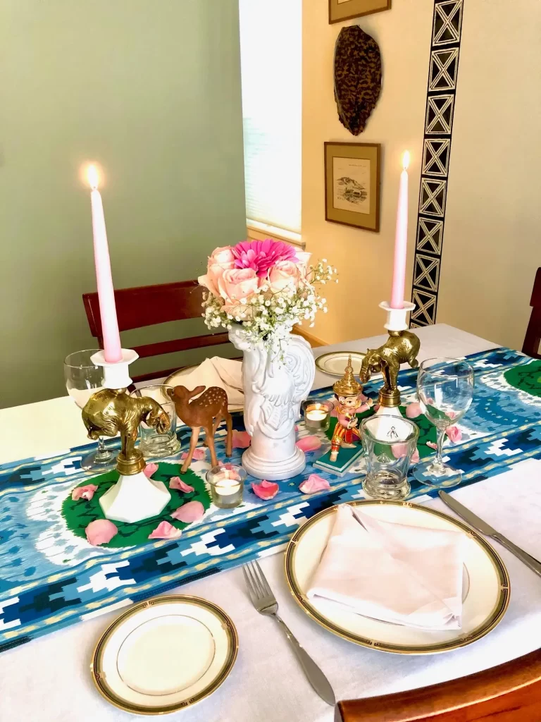 A simple table-setting in a Southeast Asian theme featuring an ikat table runner.