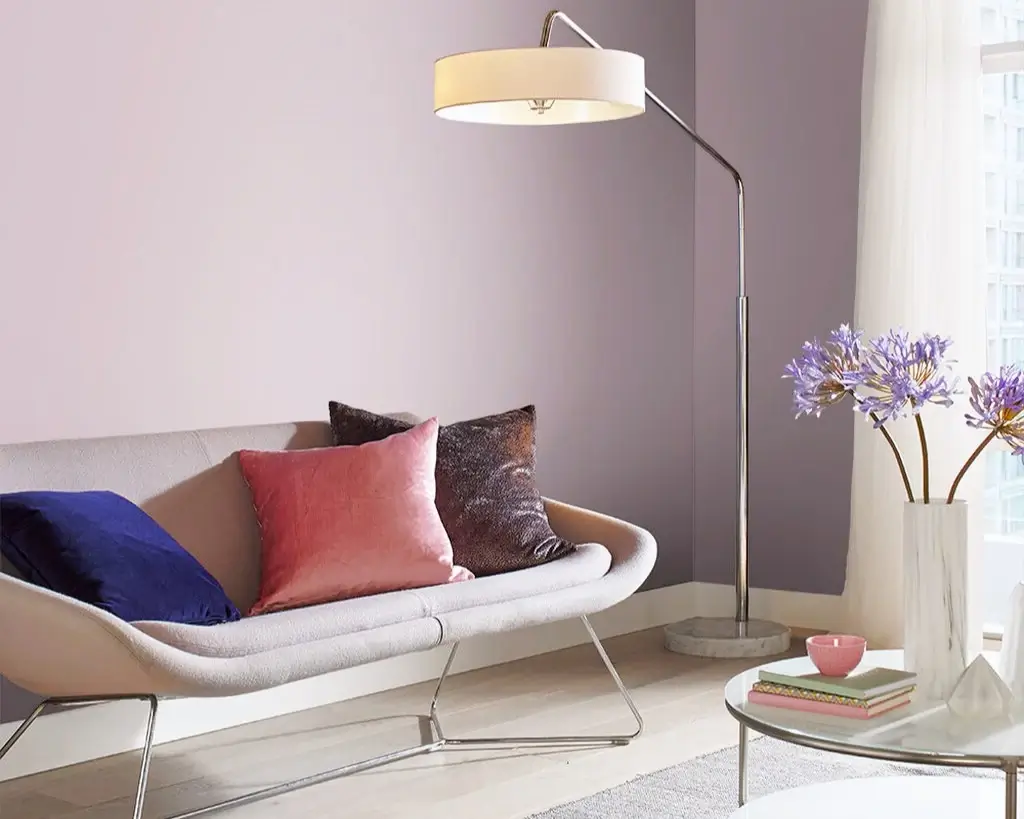 A living room featuring contemporary interior design and pastel purple painted walls.