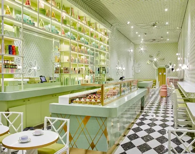The interior of Laduree in Beverly Hills, with pastel pistachio green interior.