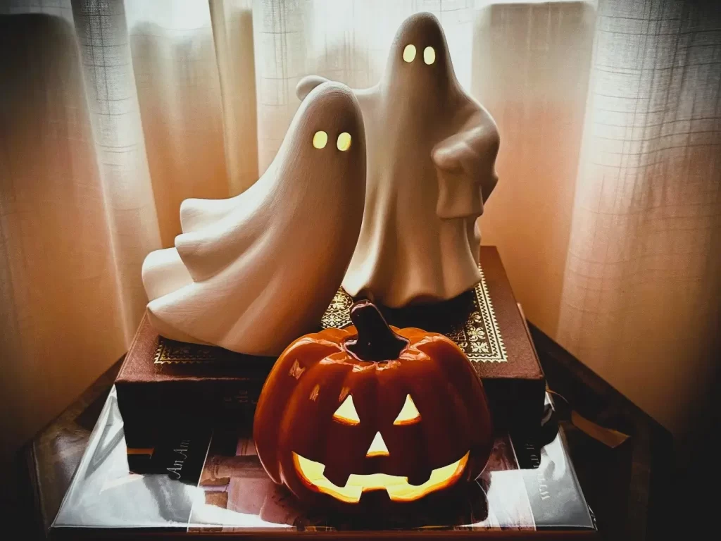 Ceramic Halloween Ghosts and Jack-o'-lantern luminaries. Tasteful Halloween Decor vignette